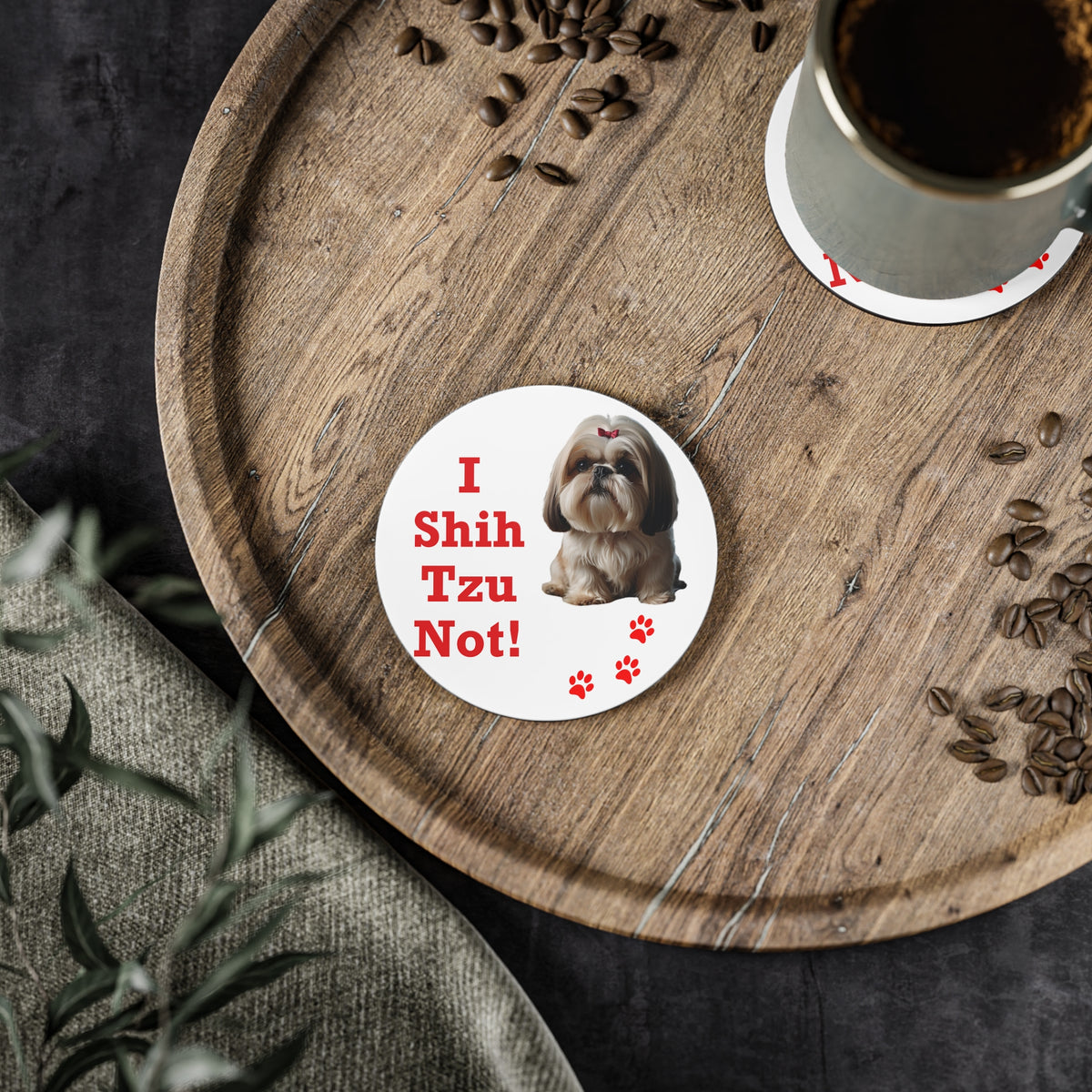 #19 I Shih Tzu Not round coaster on a wooden board beside a cup of coffee