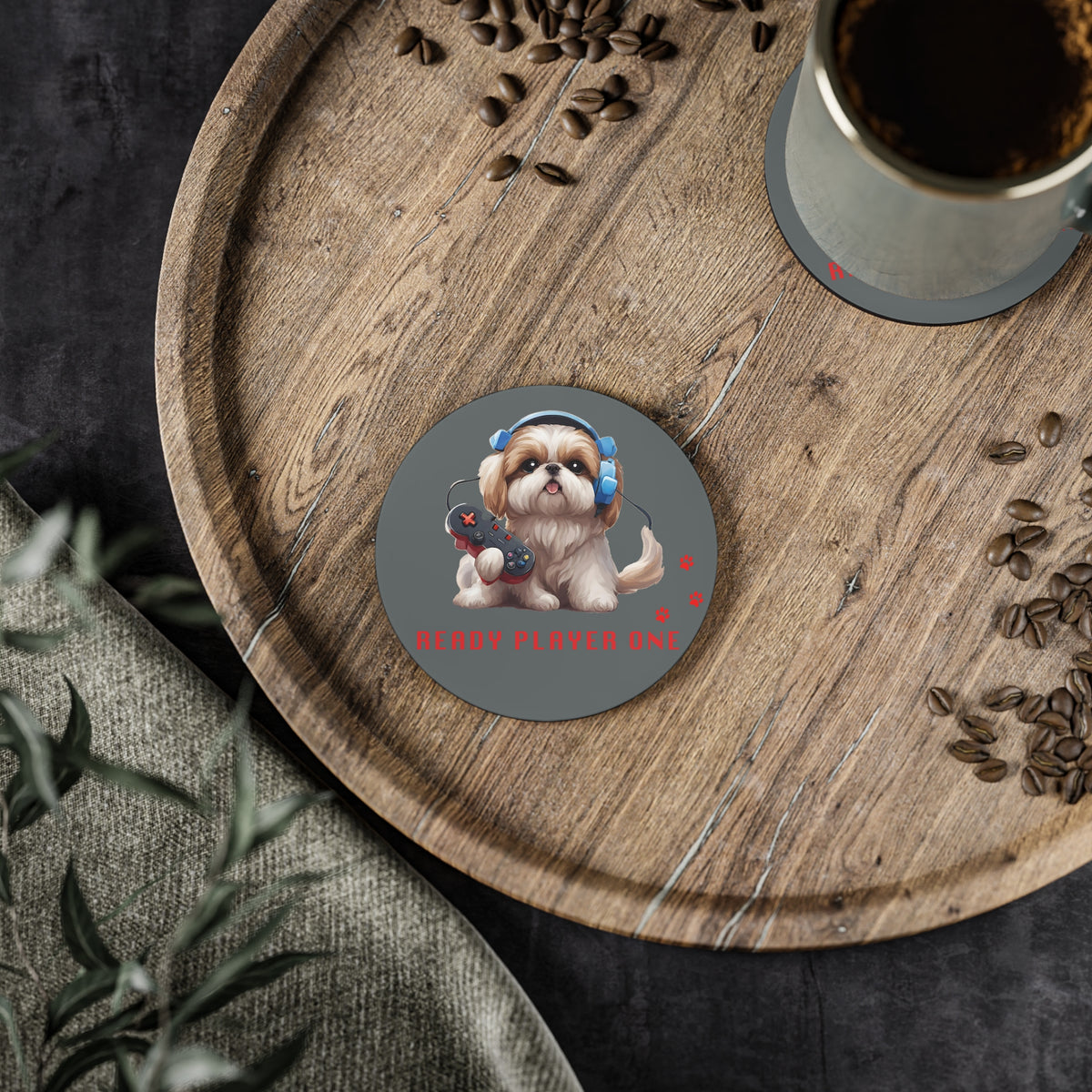 #18 Ready Player One round coaster on a wooden board beside a cup of coffee