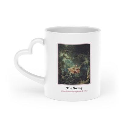 #48 The Swing mug — the framed painting with its title and artist beneath, as seen from across the table