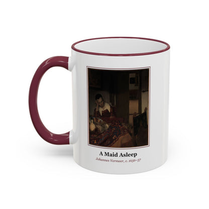 #60 A Maid Asleep mug — the framed painting with its title and artist beneath, as seen from across the table