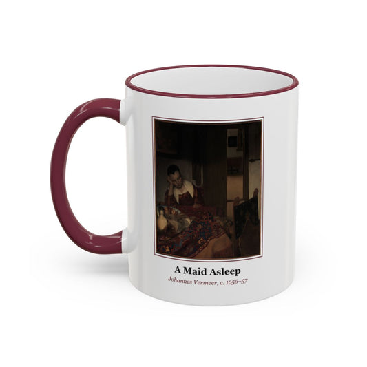 #60 A Maid Asleep mug — the framed painting with its title and artist beneath, as seen from across the table