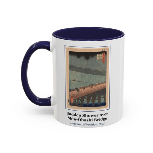 #80 Sudden Shower over Shin-Ōhashi Bridge mug — the framed painting with its title and artist beneath, as seen from across the table