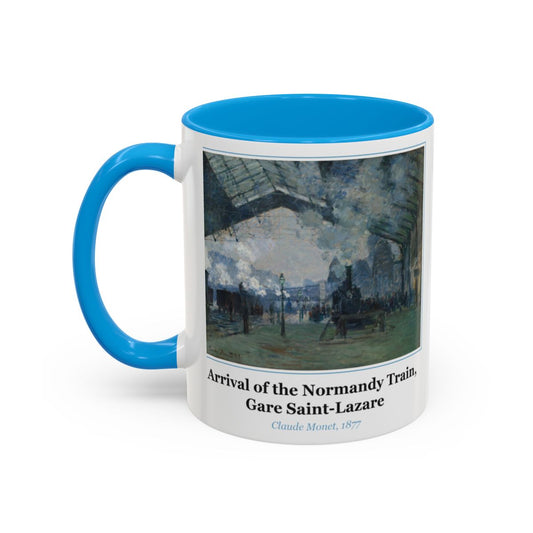 #87 Arrival of the Normandy Train, Gare Saint-Lazare mug — the framed painting with its title and artist beneath, as seen from across the table