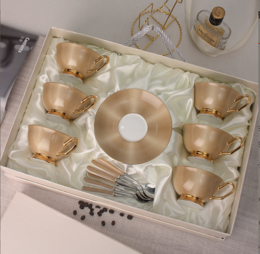 Gilded bone china coffee set in its gift box, six cups, six saucers and six spoons