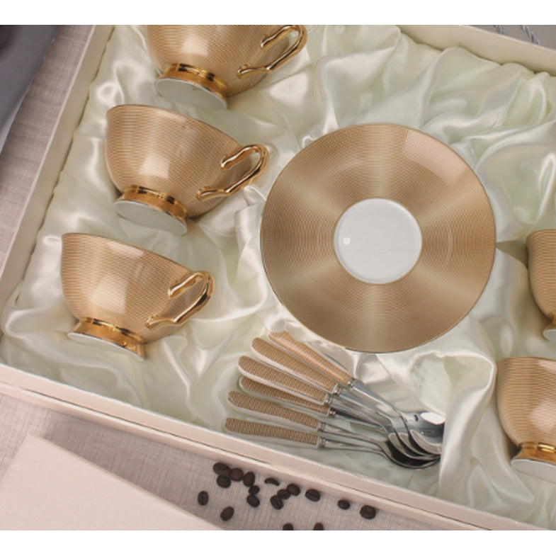 Close view of the gilded finish on the cups and saucer