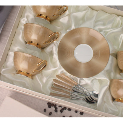 Close view of the gilded finish on the cups and saucer